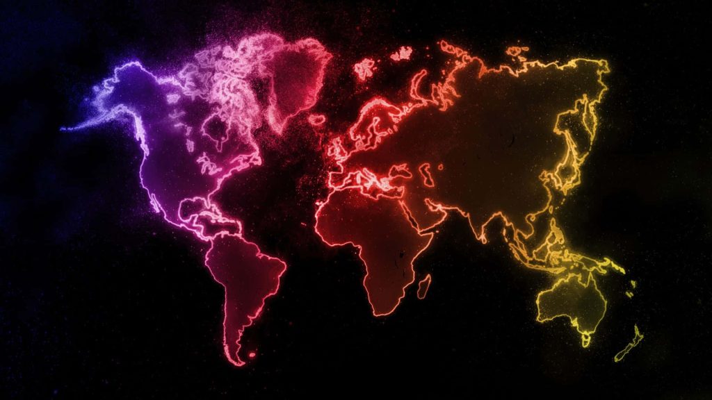 Vibrant neon glowing world map wallpaper with colorful particle contours on dark background