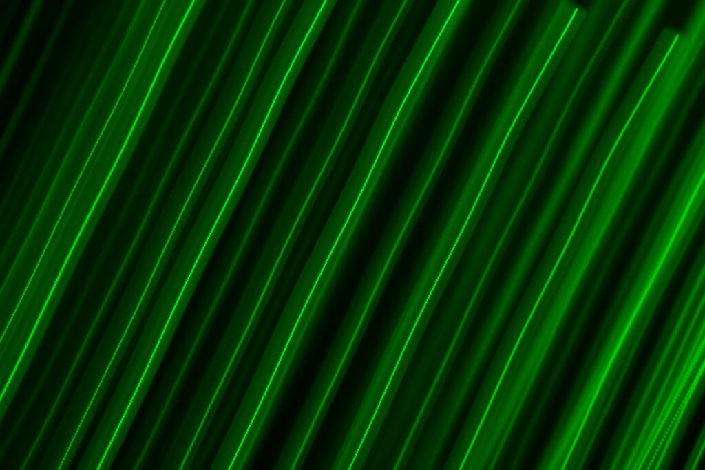 Vibrant Neon Green Stripes on Dark Background - Modern Abstract Wallpaper
