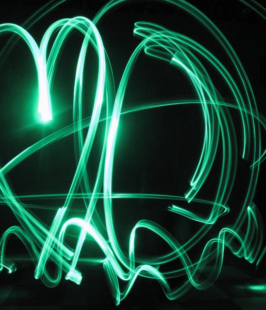 Vibrant Neon Green Graffiti Wallpaper on Black Background