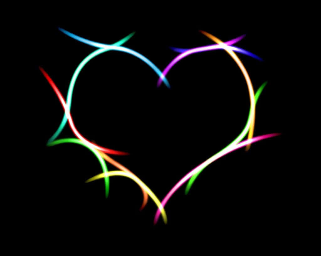 Vibrant Neon Heart Art: Multicolored Glow on Black Wallpaper