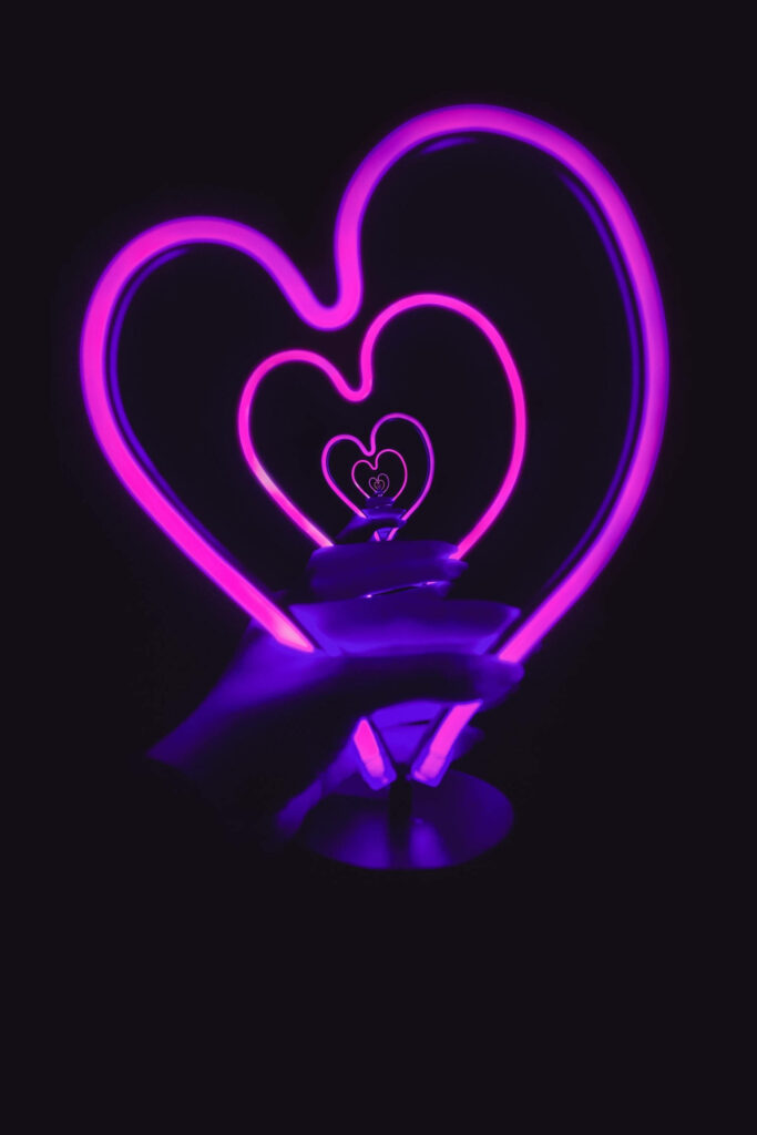 Vibrant Neon Heart Wallpaper in Pink & Purple on Dark Background