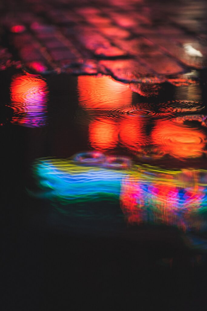 Vibrant Neon Lights Reflection Wallpaper Background - Colorful Water Art