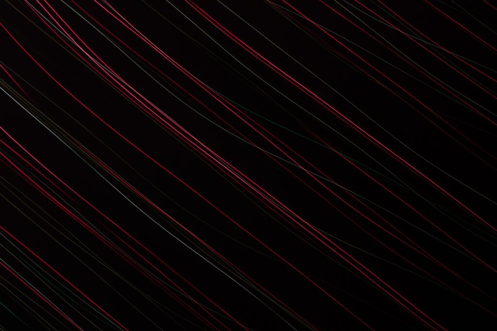 Vibrant Neon Thread Wallpaper on Dark Background - High Resolution