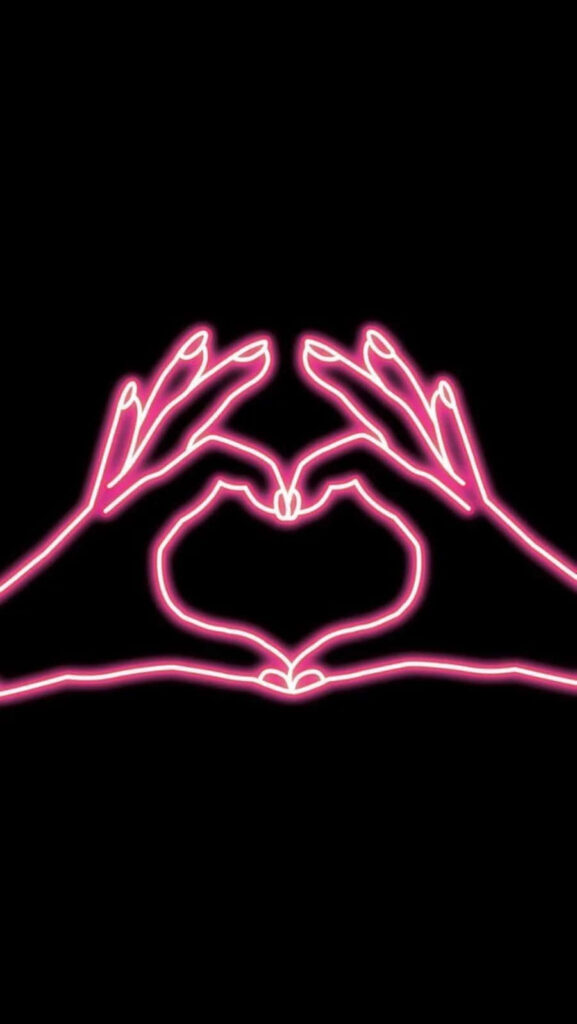 Vibrant Neon Pink Heart Wallpaper on Black Background