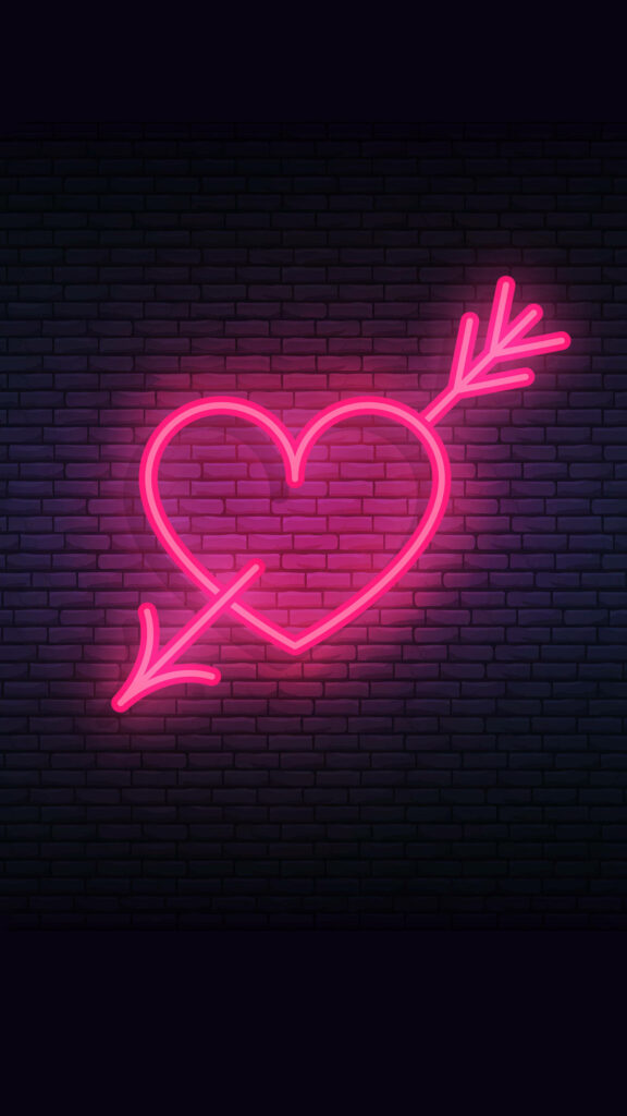 Vibrant Neon Pink Heart with Arrow on Dark Brick Wallpaper