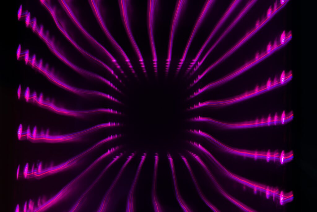 Vibrant Neon Pink Stripes Abstract Wallpaper on Black Background