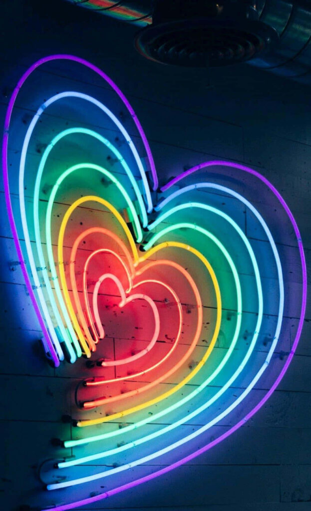Neon Rainbow Heart Wallpaper: Vibrant Glow on Dark Background