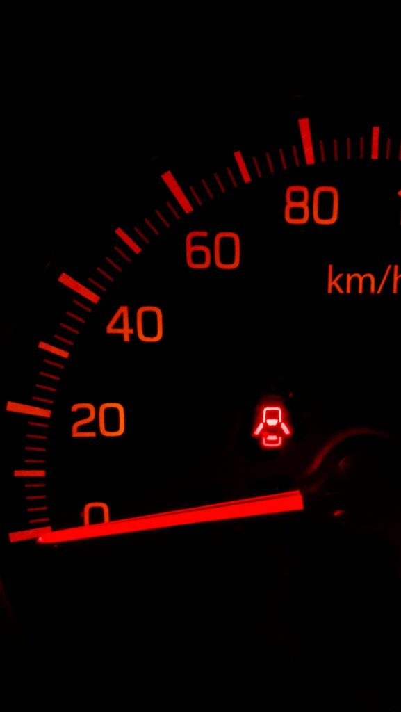 Neon Red Speedometer Wallpaper: Dynamic Close-Up Design