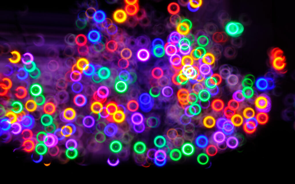Vibrant Neon Ring Wallpaper: Abstract Colors on Dark Background