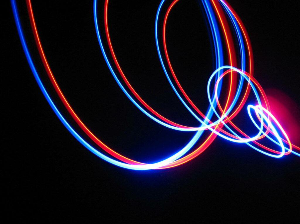 Luminous Artistry: Captivating Neon Light Loop Creation on a Midnight Canvas Wallpaper