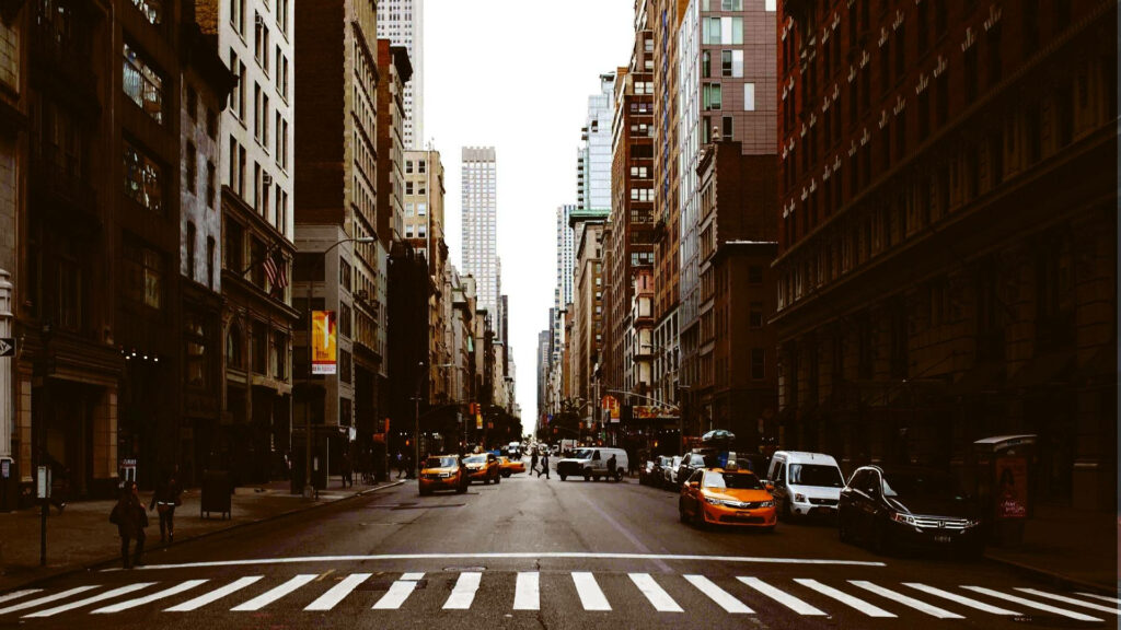Morning Rush in NYC: Vibrant Street Scene Wallpaper Background