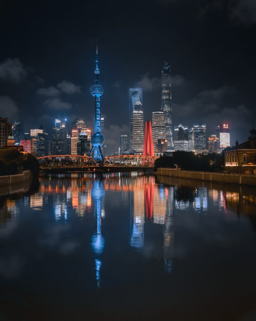 Vibrant Night City Wallpaper: Illuminated Buildings & Reflected Waters
