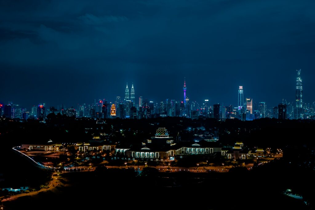 Vibrant Night Cityscape Wallpaper: Illuminated Skyline & Dark Sky