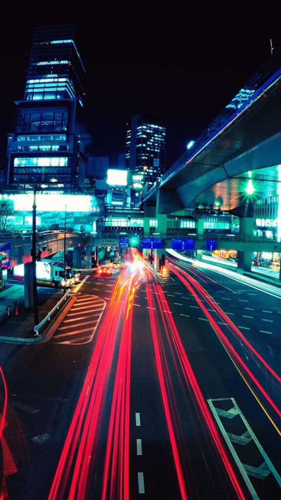 Vibrant Cityscape Night Wallpaper: Dynamic Light Trails & Urban Energy