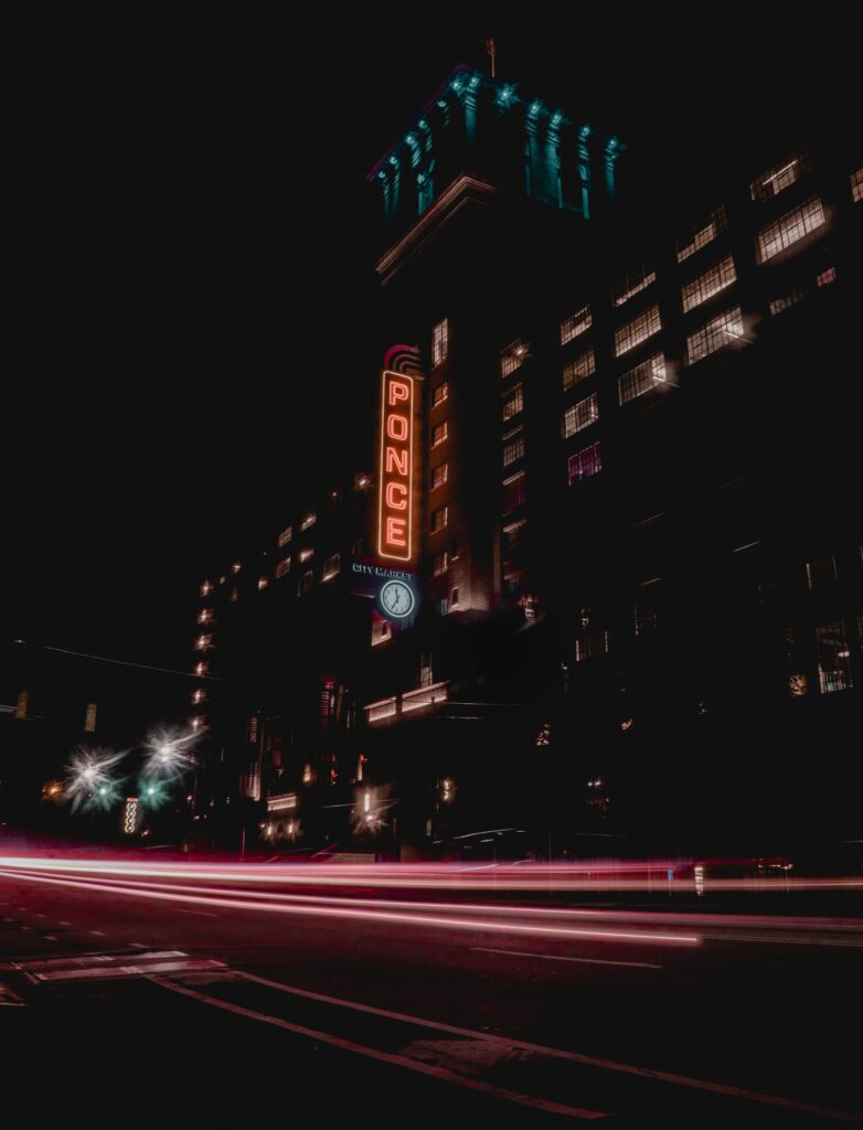Vibrant Night Cityscape Wallpaper with Neon PONCE Sign