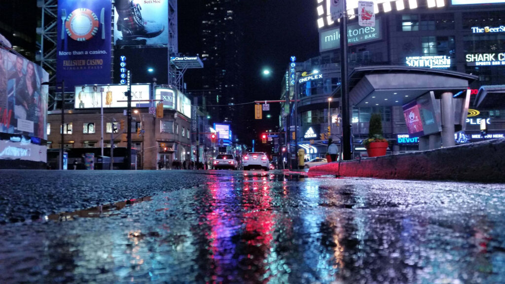 Neon City Lights on Wet Road - Vibrant Urban Night Wallpaper