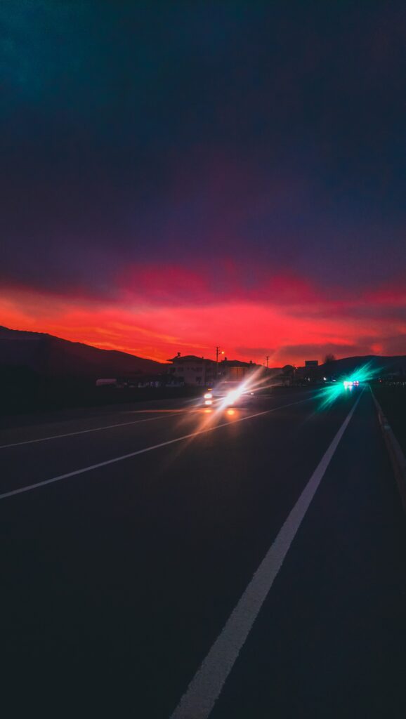 Vibrant Night Scene Wallpaper: Dramatic Road with Motion Blur
