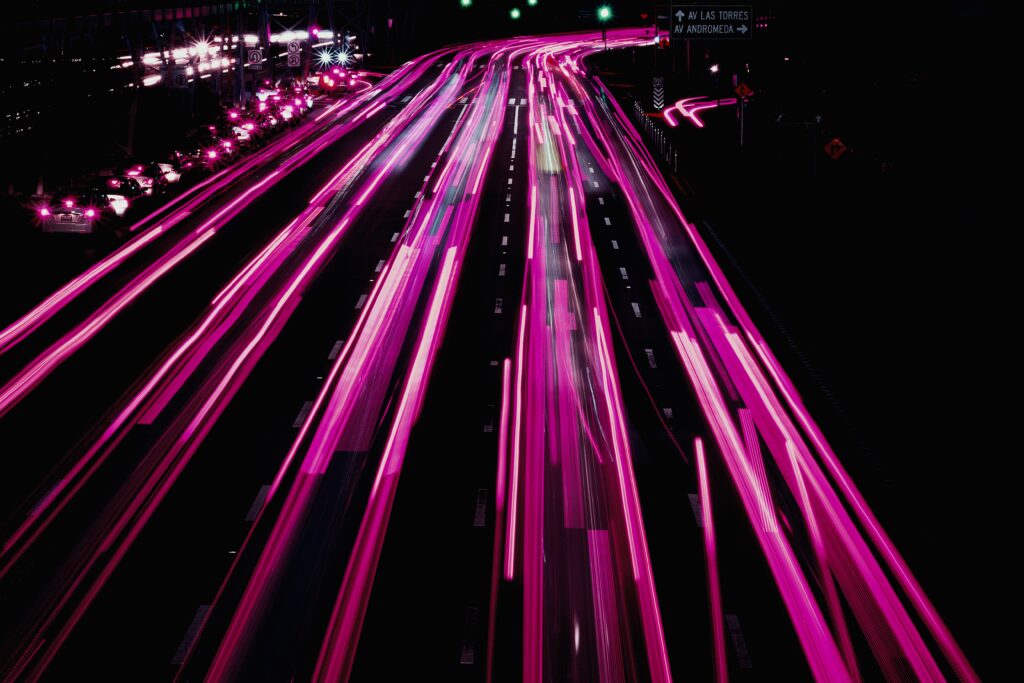 Vibrant Night Road Wallpaper: Pink Neon Lights & Motion Energy