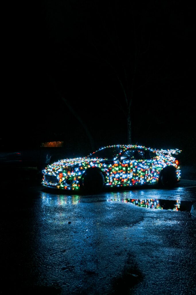 Vibrant Light-Adorned Car Wallpaper: Captivating Night Reflection