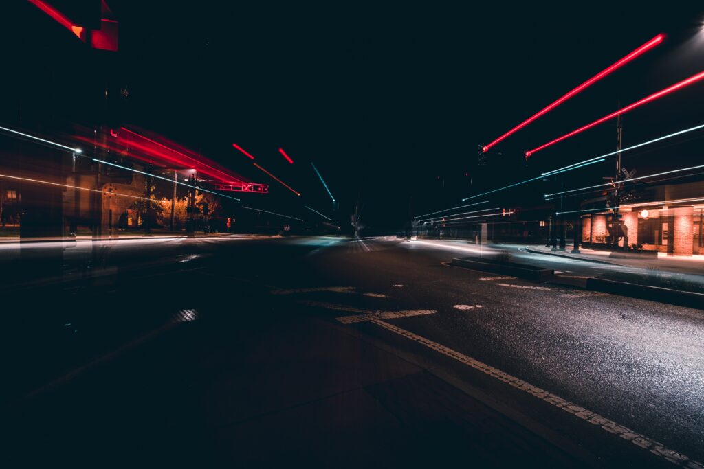 Vibrant Nighttime City Street Wallpaper: Dynamic Light Streaks