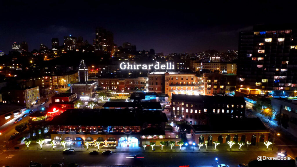 Glowing Nighttime Ghirardelli Square: Vibrant City Wallpaper
