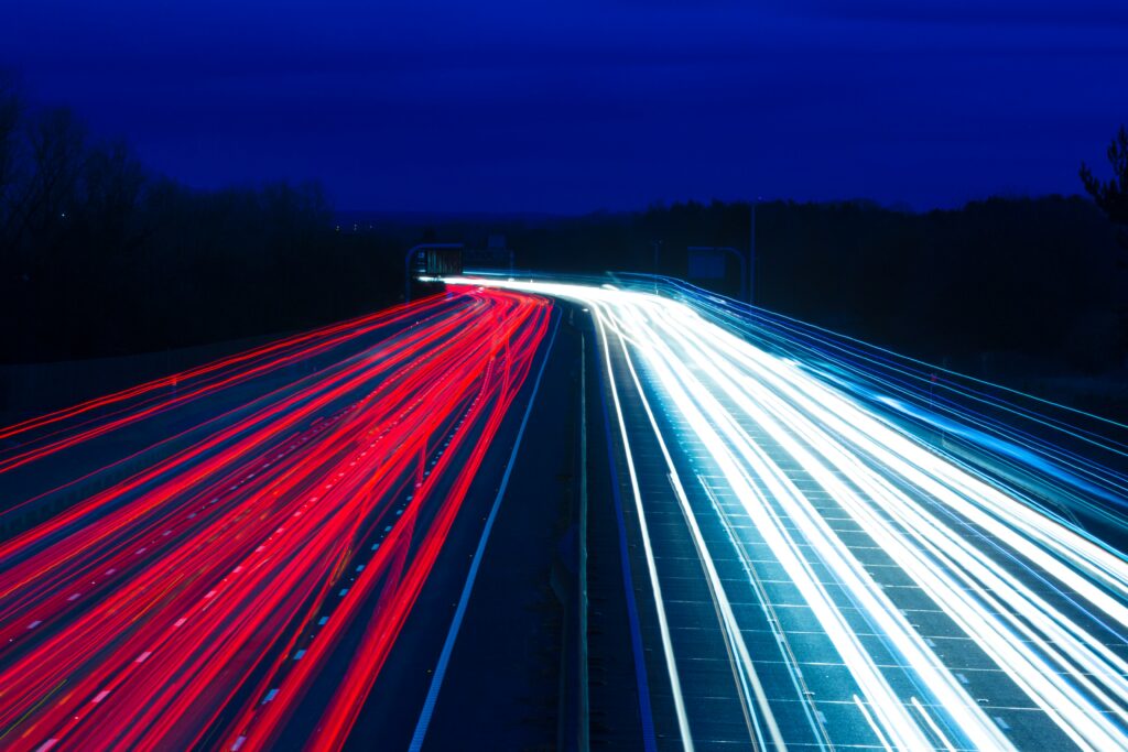 Vibrant Nighttime Motorway Wallpaper: Red & White Light Trails