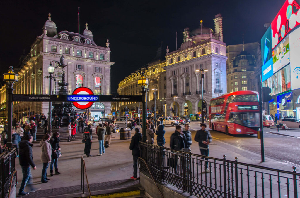 Piccadilly Circus Nightlife: Subway Entrance & Iconic London Views Wallpaper