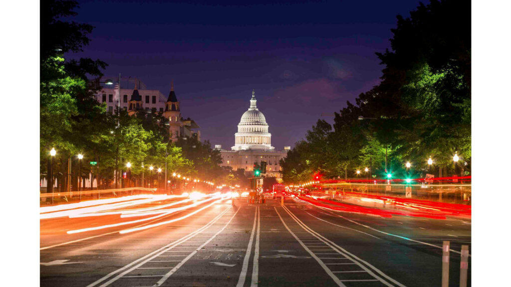 Vibrant Nighttime Washington, DC: Illuminated Capitol & Light Trails Wallpaper
