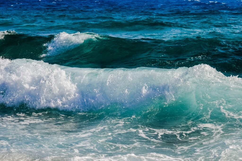 Vibrant ocean wallpaper with rolling blue waves white foam and detailed dynamic water textures