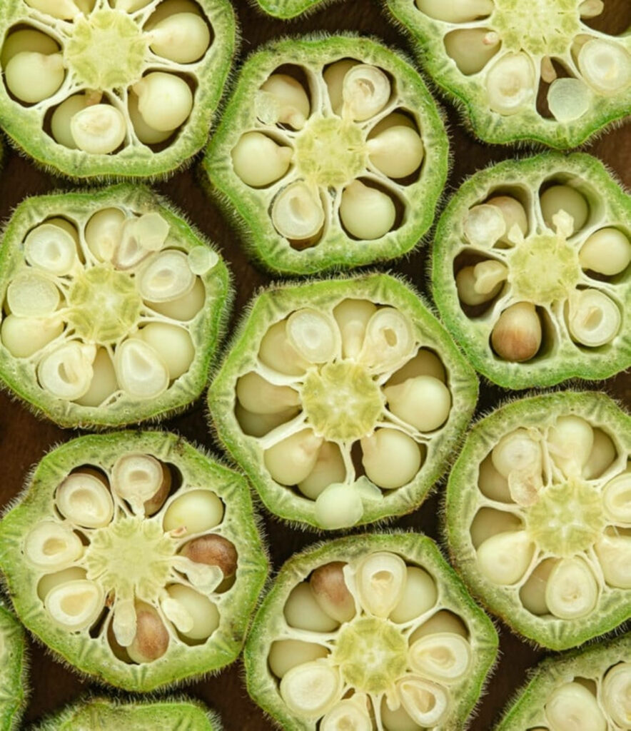Vibrant Sliced Okra Wallpaper: Fresh, Textured Background Design