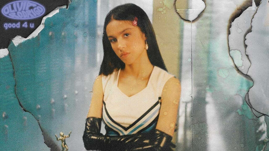 Olivia Rodrigo Wallpaper: Vibrant Background & Stylish Confident Pose