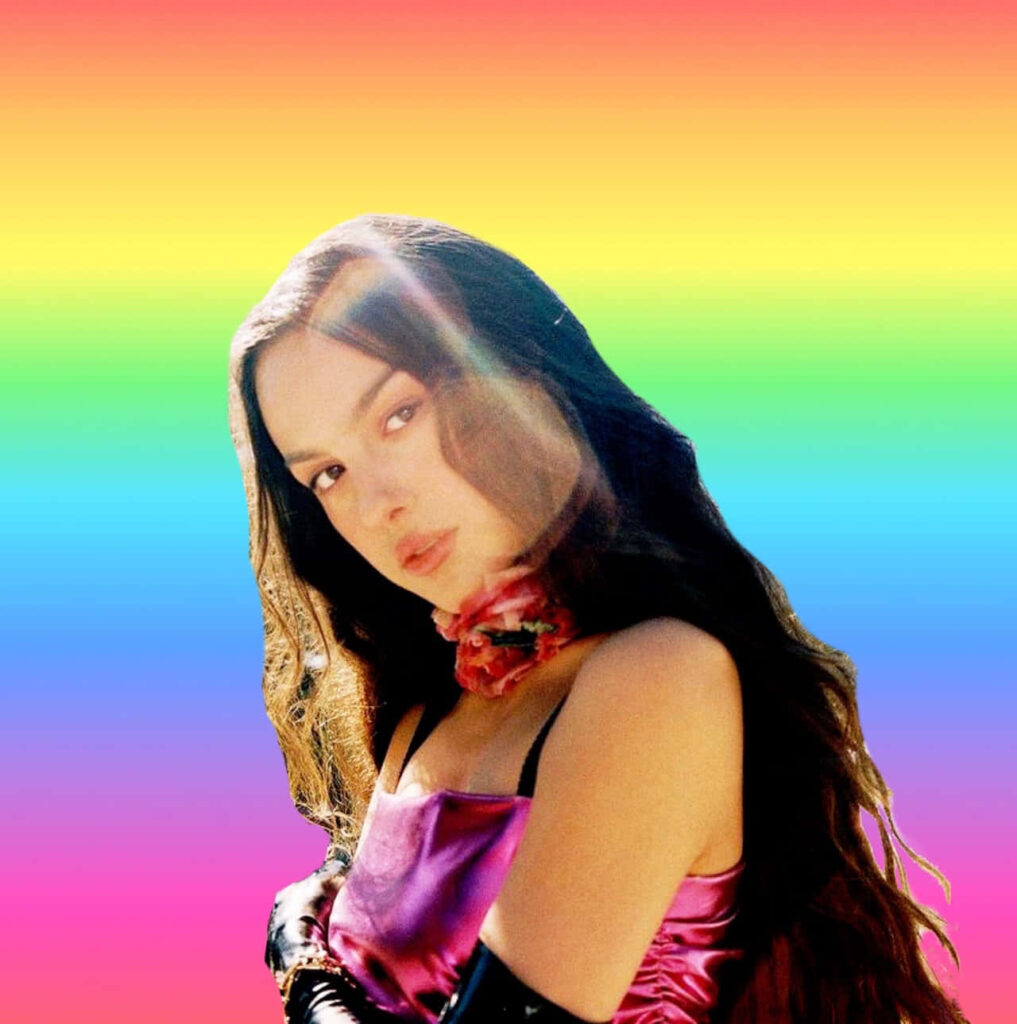 Vibrant Olivia Rodrigo Wallpaper with Bold Rainbow Gradient Background
