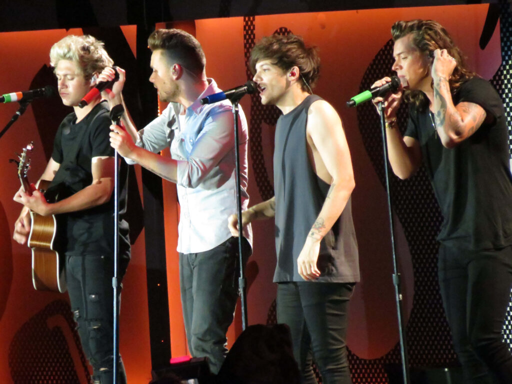 Vibrant Harmony: One Direction Captured with Colorful Microphones Wallpaper