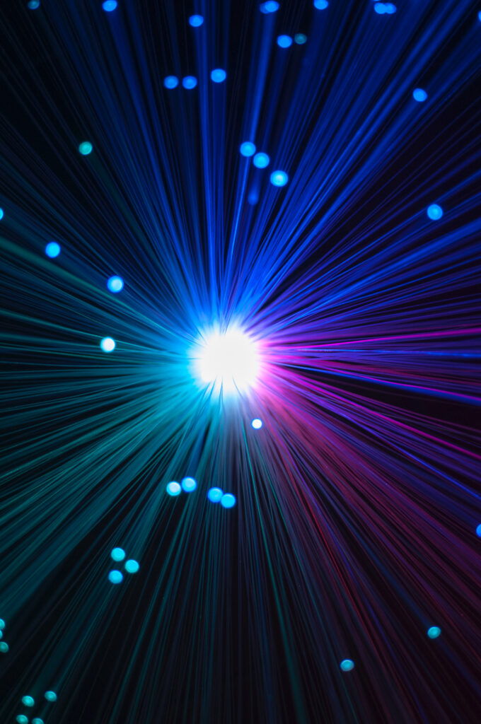 Vibrant Optical Fiber Wallpaper: Glowing Threads of Light Background