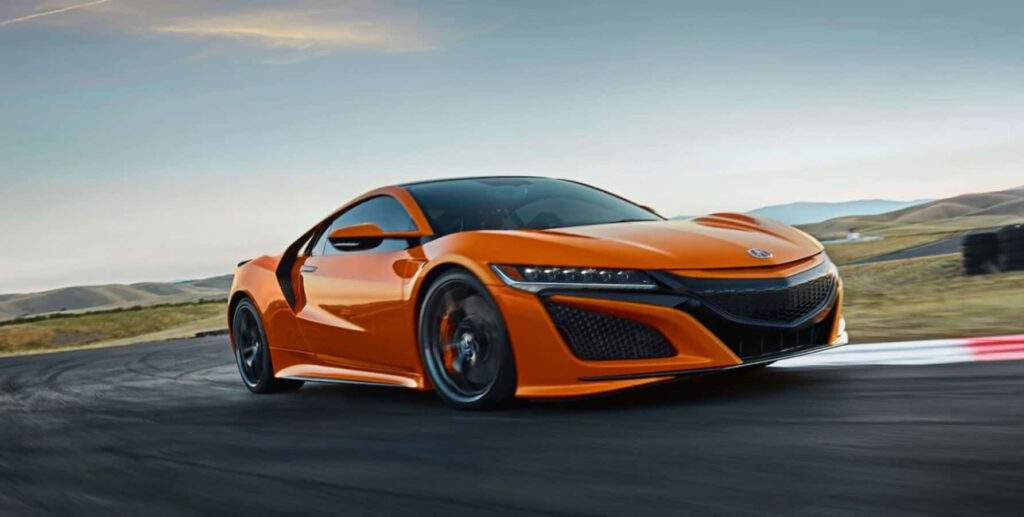 Vibrant Acura Sports Car Wallpaper: Luxury on the Racetrack