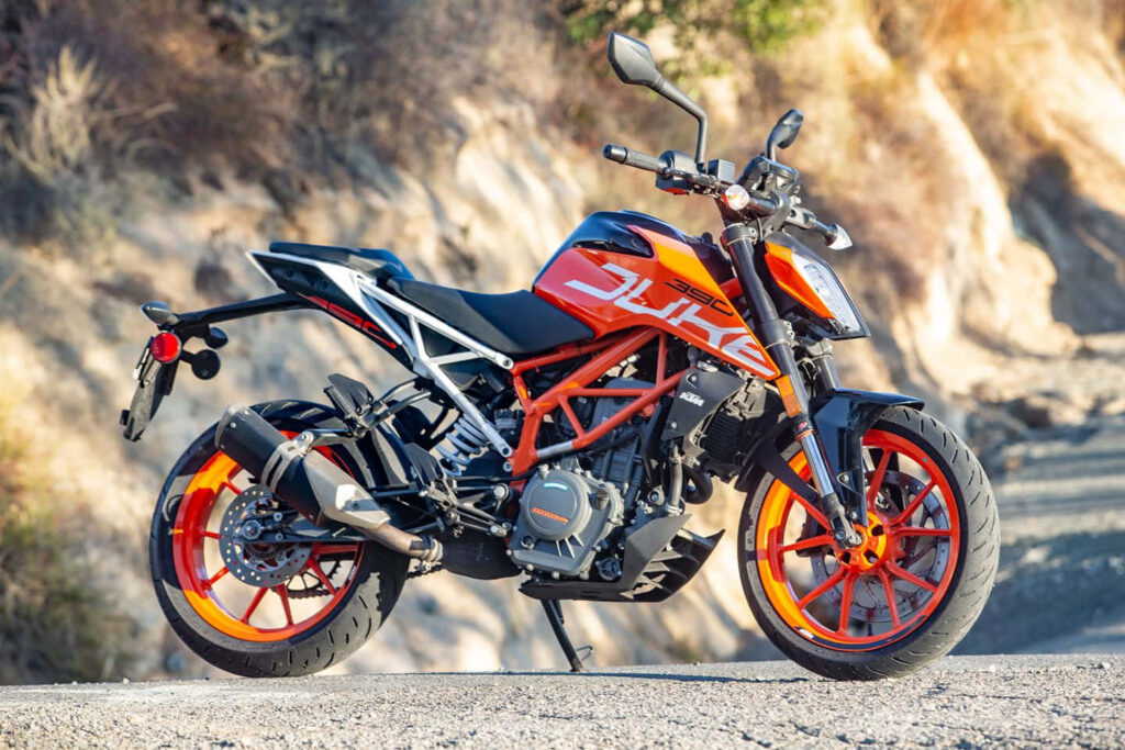 Vibrant Orange and Black Motorcycle Wallpaper - Intense Speed & Performance