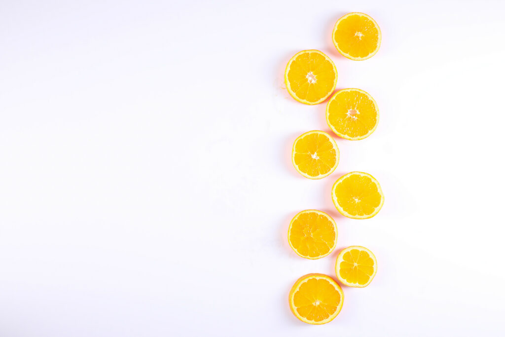 Vibrant Orange Citrus Wallpaper on Clean White Background
