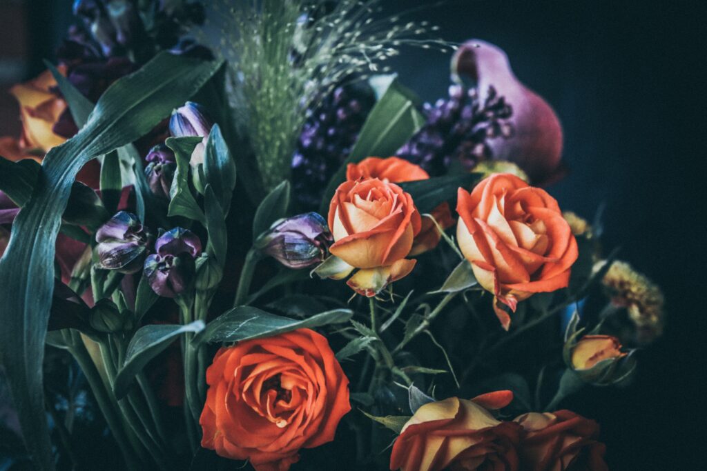 Vibrant Orange Flower Bouquet Wallpaper on Dark Background