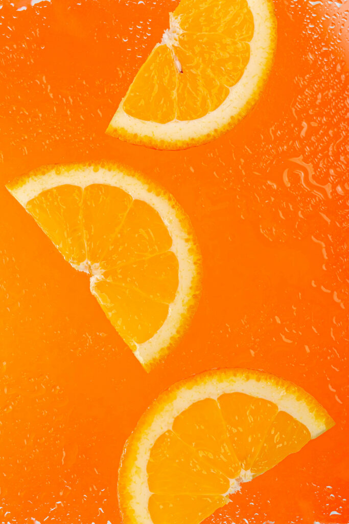 Vibrant Orange Fruit Wallpaper: Refreshing Citrus Background