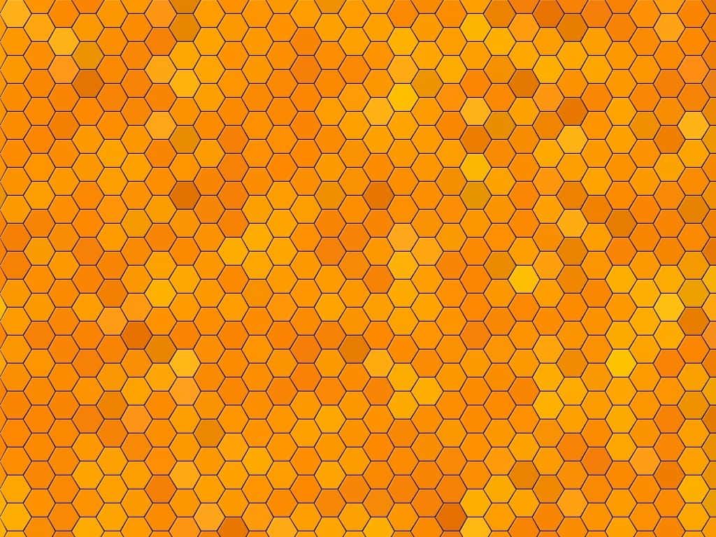 Vibrant orange honeycomb pattern wallpaper with warm amber and yellow geometric design