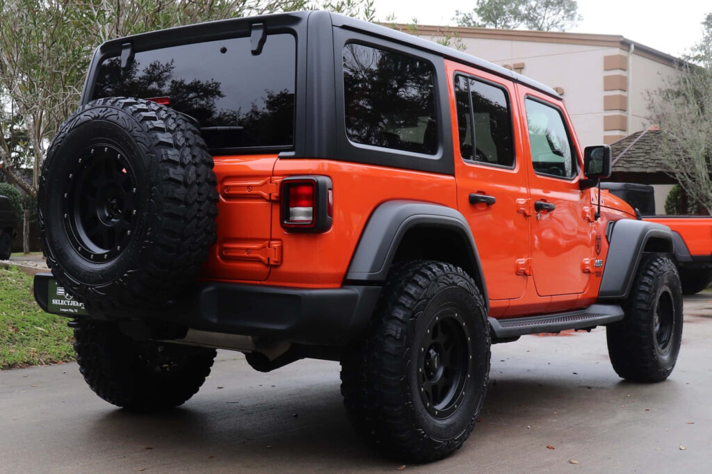 Vibrant Orange Jeep Wrangler Wallpaper: Rugged Adventure Aesthetic