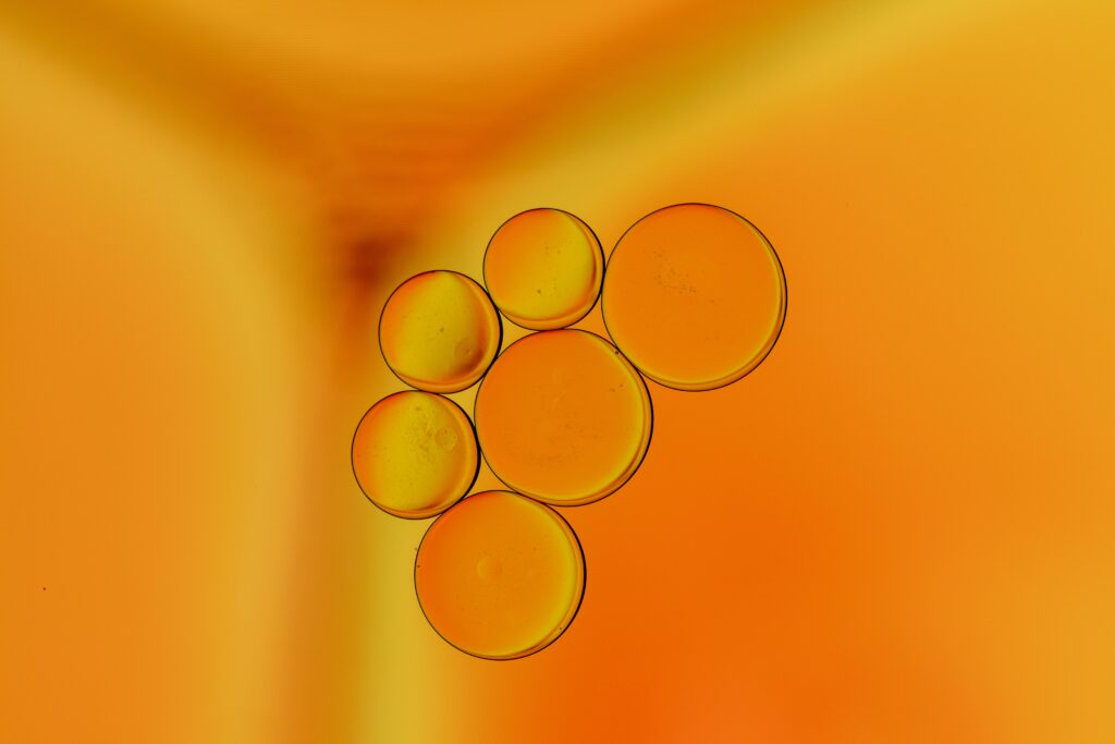 Vibrant Orange Liquid Macro Wallpaper with Mesmerizing Bubbles