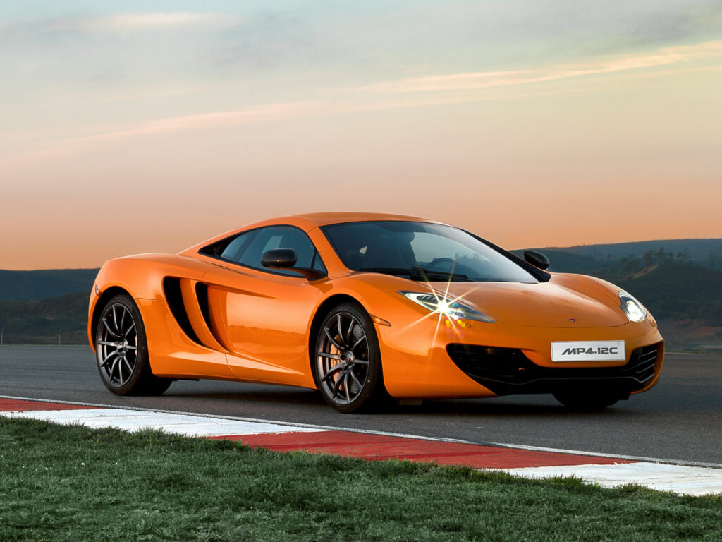 Stunning Side View of McLaren MP4-12C in Twilight on Racing Track Wallpaper