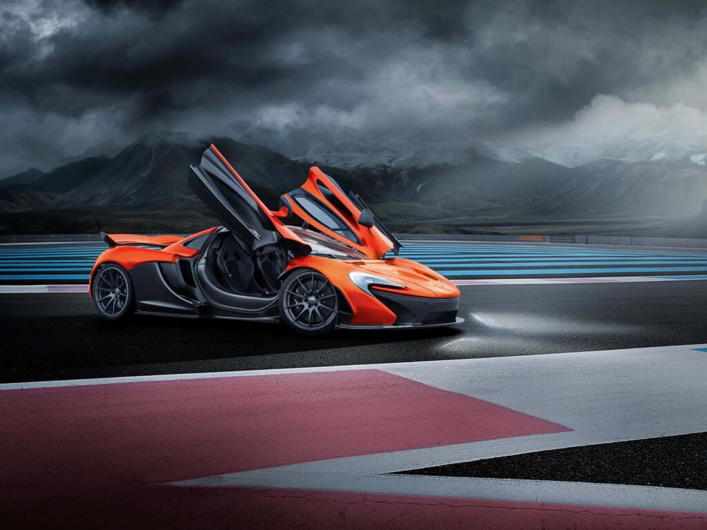 Stunning Orange McLaren Supercar on Racetrack - Wallpaper Background