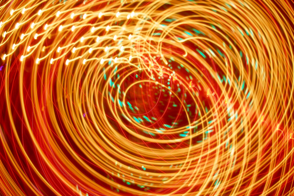 Vibrant Orange Neon Light Rays Background for Modern Digital Screens Wallpaper