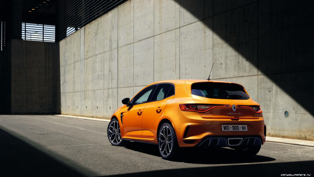Vibrant Orange Renault Megane Wallpaper with Urban Concrete Backdrop