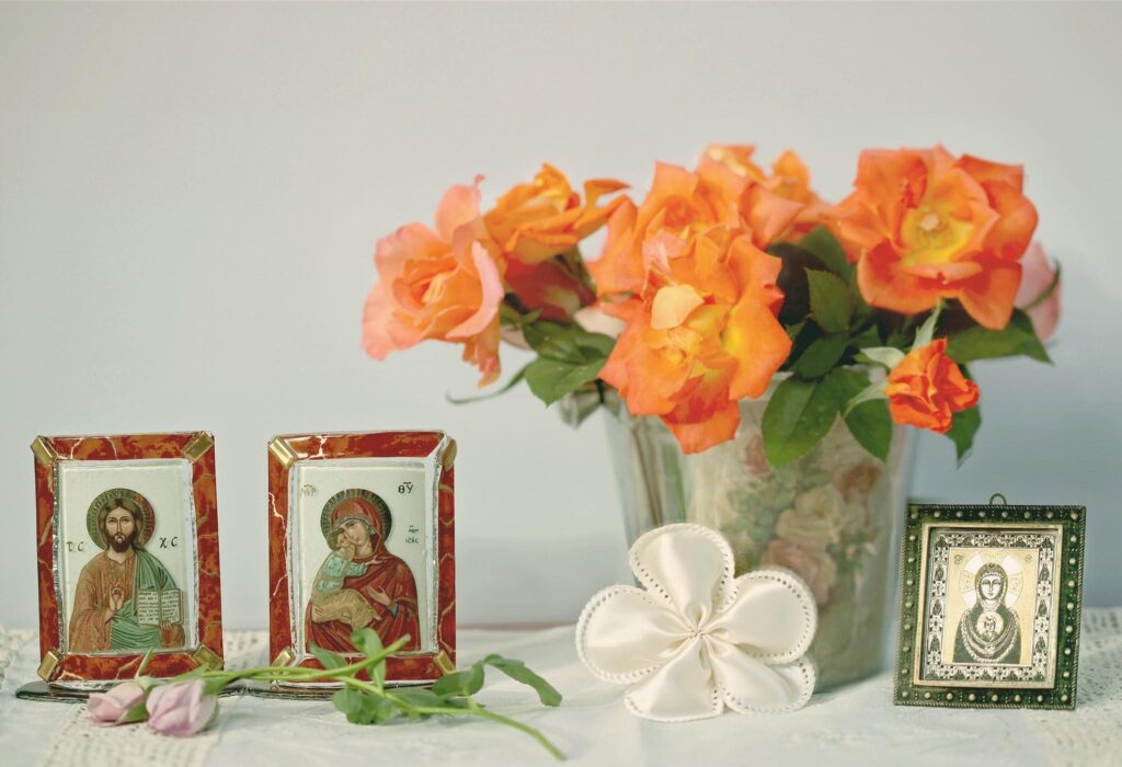 Vibrant Orange Roses Wallpaper with Spiritual Icons | Serene Background