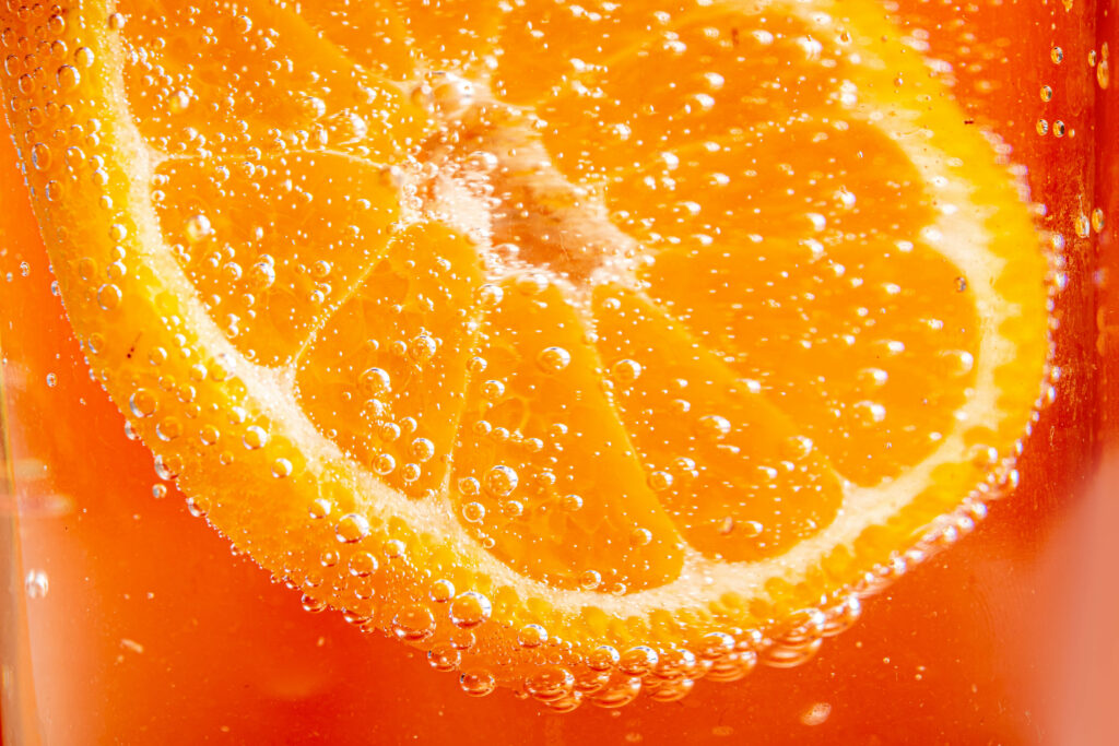 Refreshing Orange Slice in Bubbles - Vibrant Macro Wallpaper