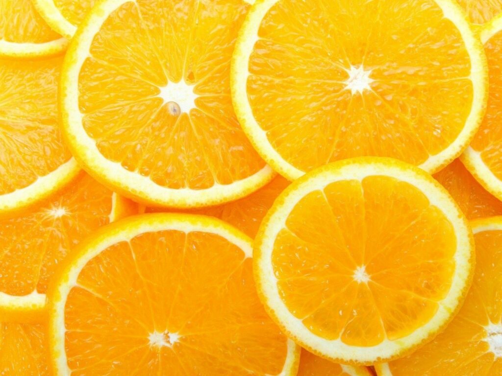 Vibrant Orange Slice Wallpaper: Fresh Juicy Segments Background