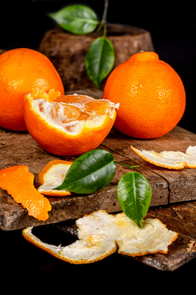 Vibrant Orange Wallpaper: Juicy Fruit Decor on Rustic Wood